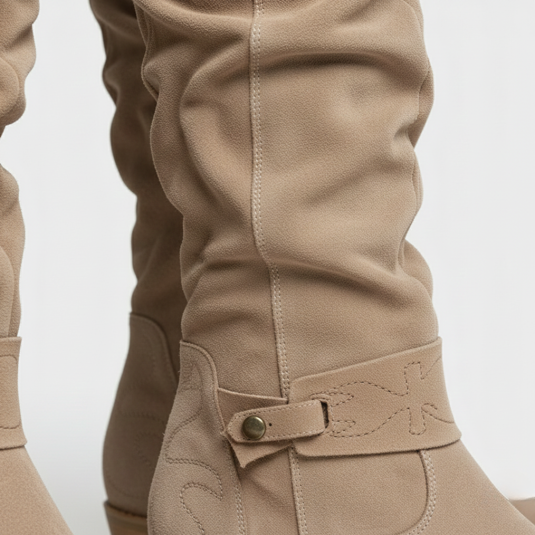 Beige knee-high boots with side buckles and a low block heel